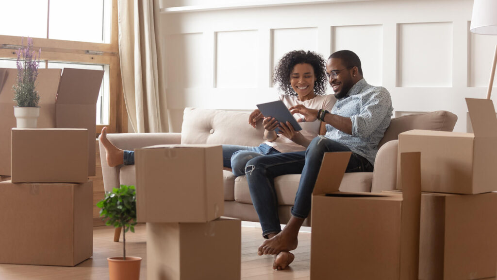 people on couch after receiving homeowners assistance